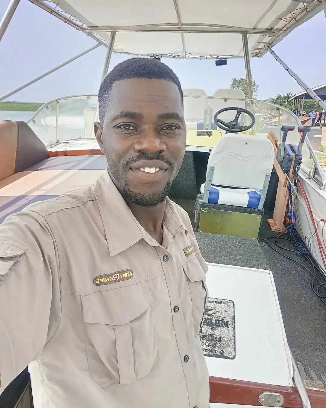 Herbert smiling aboard a boat